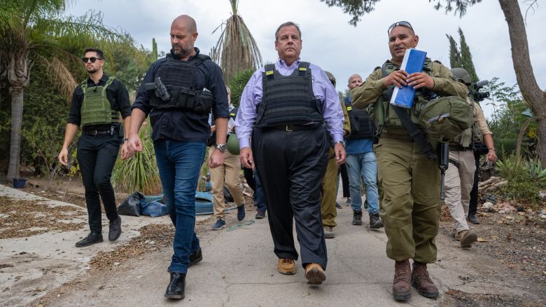 Republican Presidential candidate, former New Jersey Gov. Chris Christie (C) led by IDF Spokesperson Maj. Liad Diamond (R), and Amir Ohana (L), Speaker of the Knesset, visits Kibbutz Kfar Aza which was attacked by Hamas on Oct. 7 near the Gaza Border on November 12, 2023 in Kfar Aza, Israel. The former New Jersey governor, who is running for the Republican nomination in next year's presidential race, is visiting the country in the wake of the October 7 attacks by Hamas that left an estimated 1,200 dead and over 240 kidnapped, according to Israeli authorities.